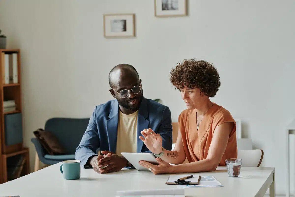 Man and woman conducting performance review